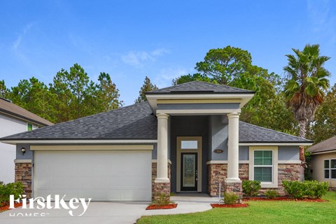 A house with a garage and a front porch.