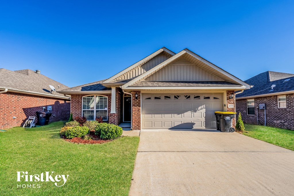 a house with a driveway and a garage door