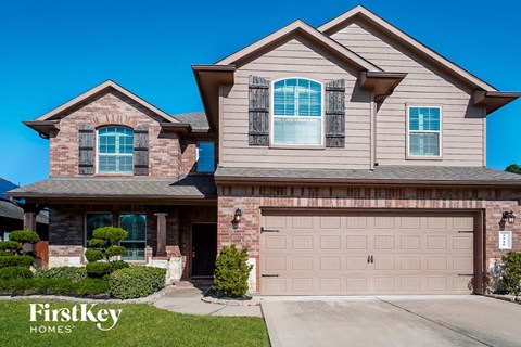 a house with a garage door in front of it