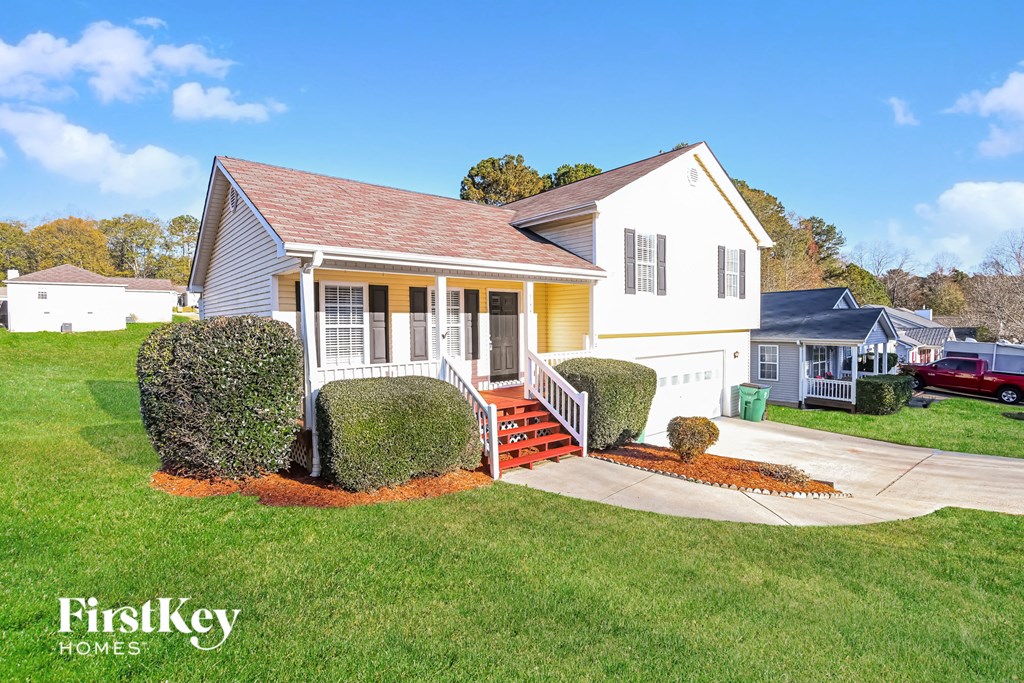 A house with a red roof and a white exterior is shown with the words "FirstKey Homes" on the bottom left.