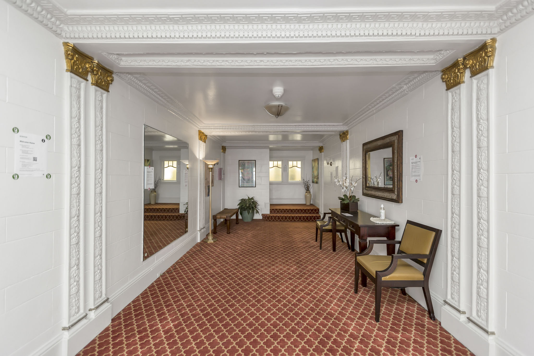 A hallway with a red and white checkered floor.