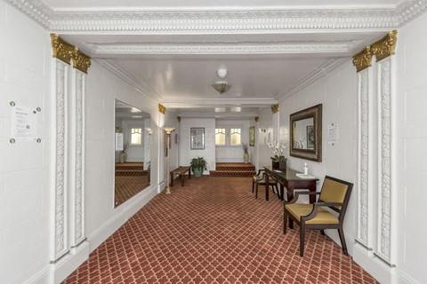 A hallway with a red and white checkered floor.