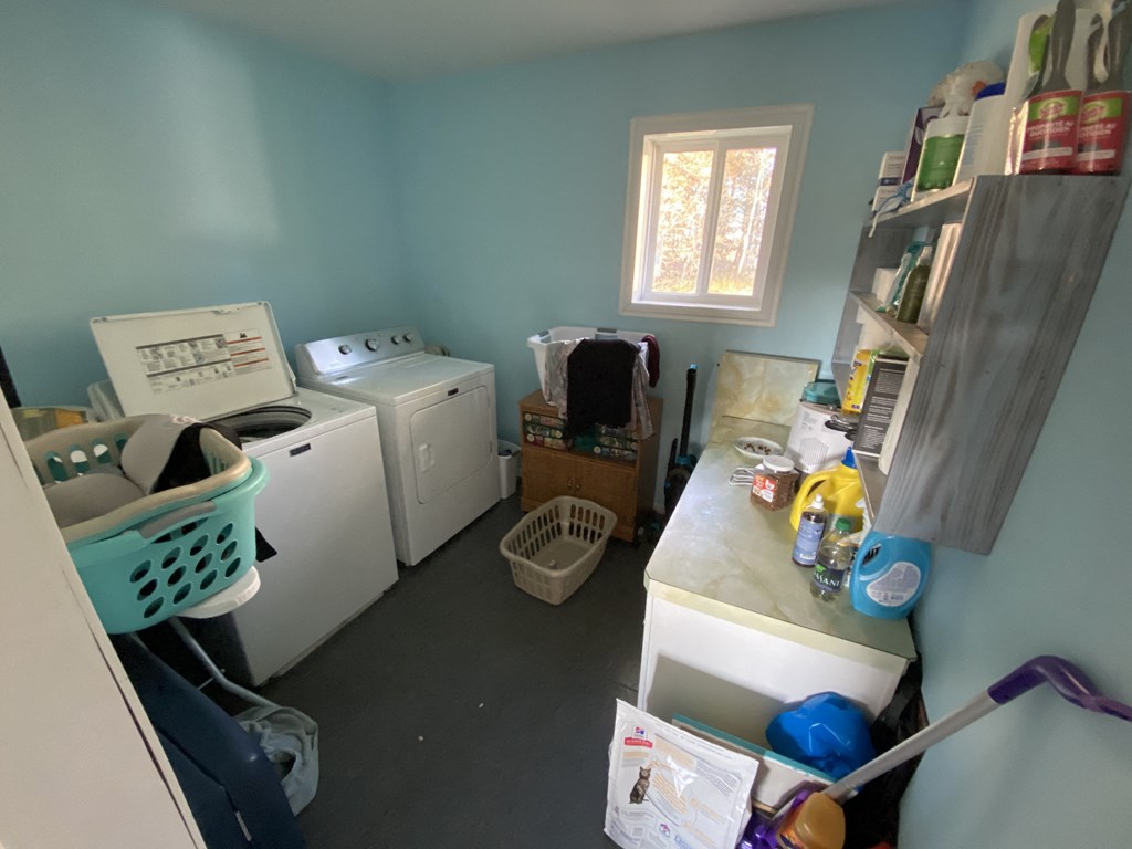 a laundry room with a washer and a dryer in it