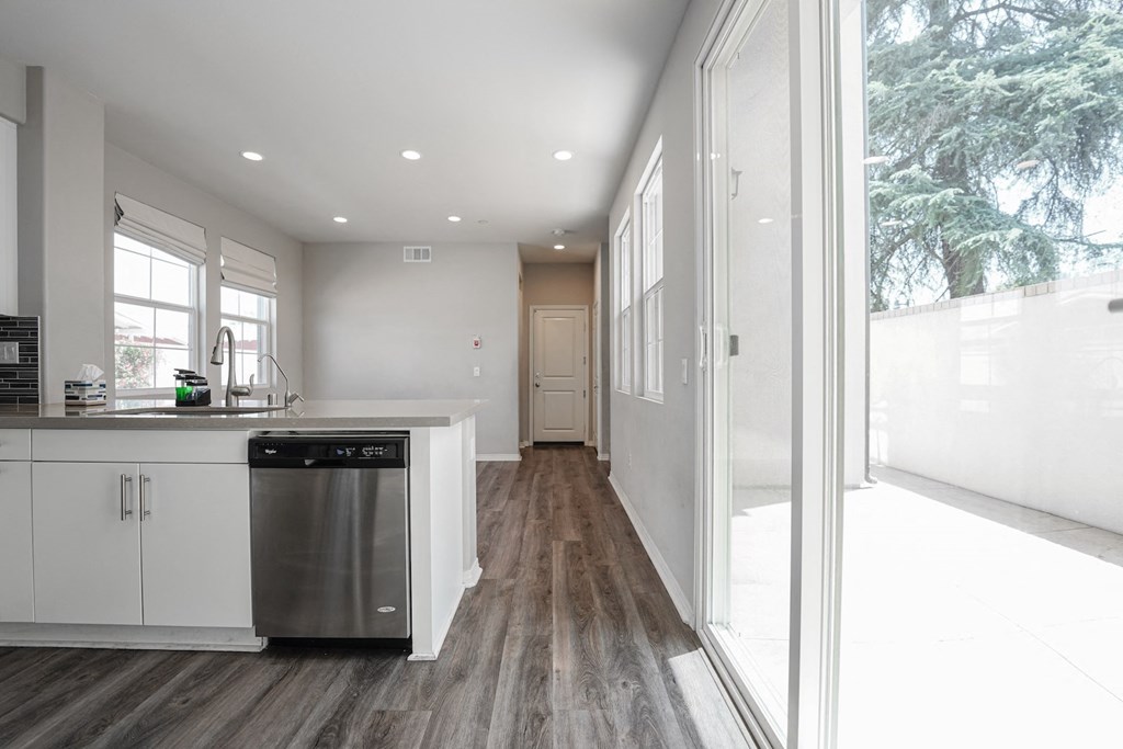 a kitchen with a dishwasher and a large window