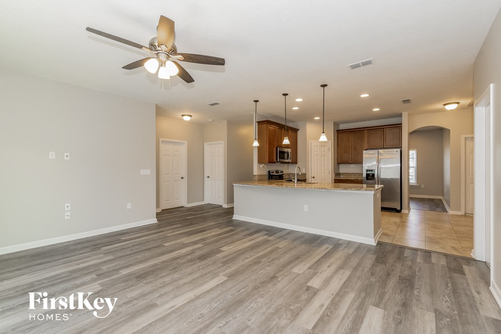 the kitchen and living room are open to the living room and dining room