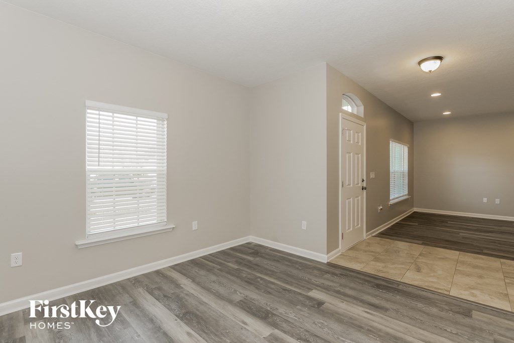 the second bedroom has a door to the hallway and a tiled floor