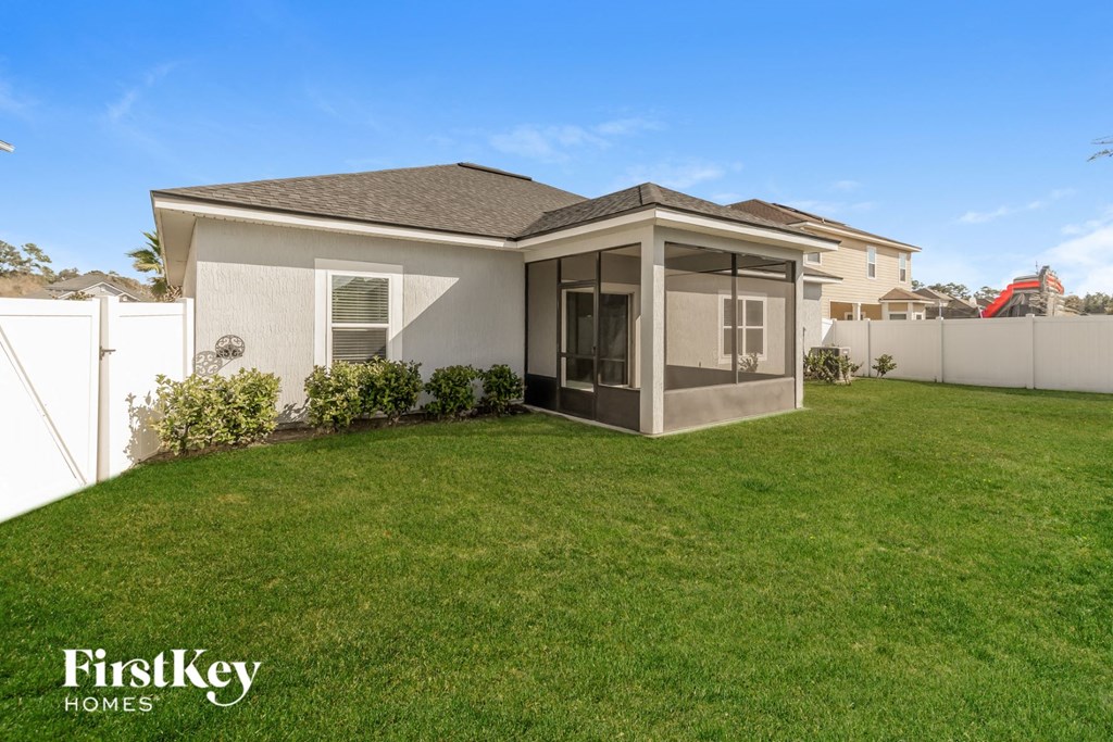 a home with a lawn and a patio