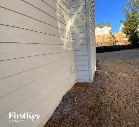 the side of a building with white siding