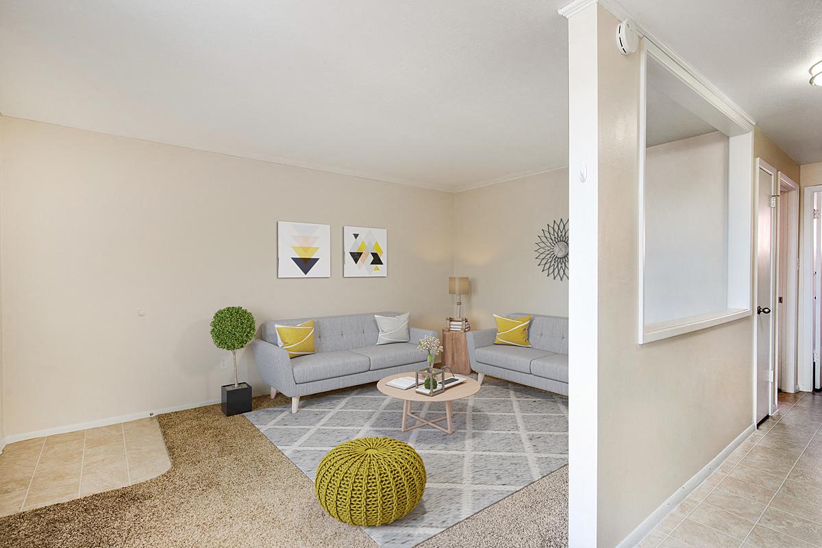 a living room with two couches and a table