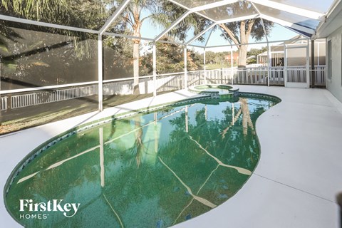 A swimming pool in a house with FirstKey Homes written on the bottom left.