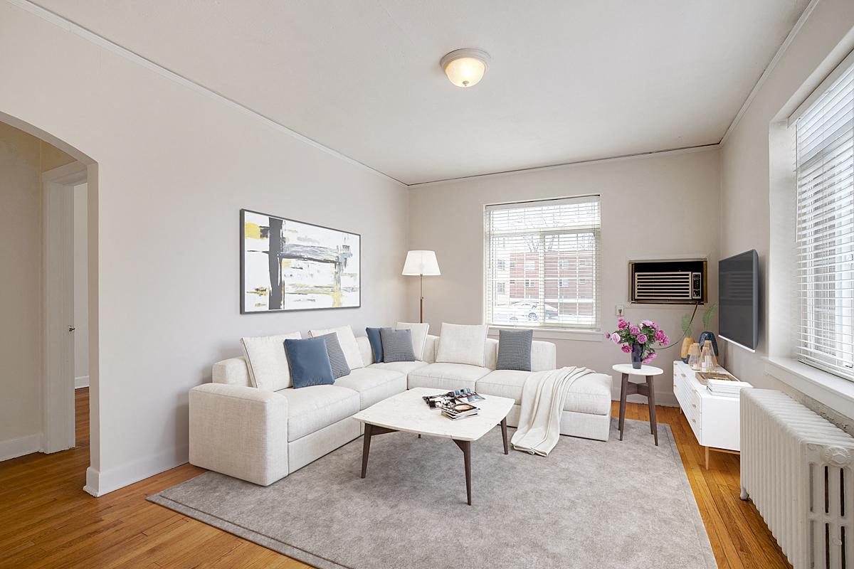 a living room with a couch and a table