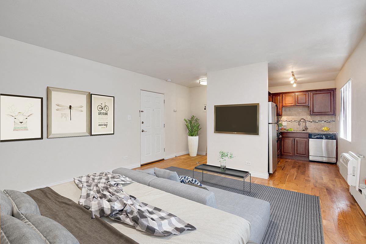 a living room with a couch and a tv