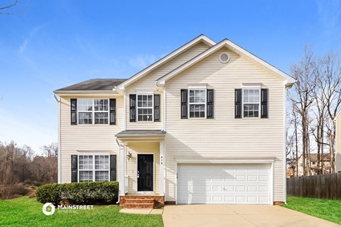 a white house with a white garage door