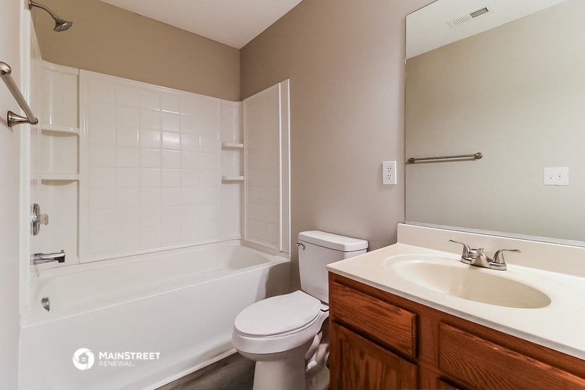 a bathroom with a sink toilet and a shower