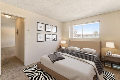 a bedroom with a bed and a window