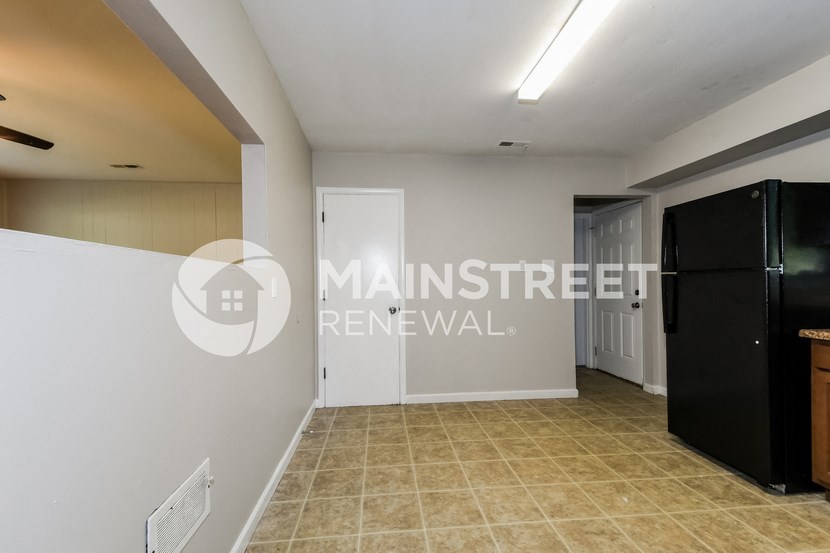 view of the living room and kitchen of the renovated apartment