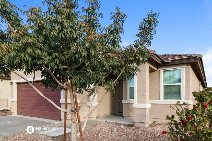 a house with a tree in front of it