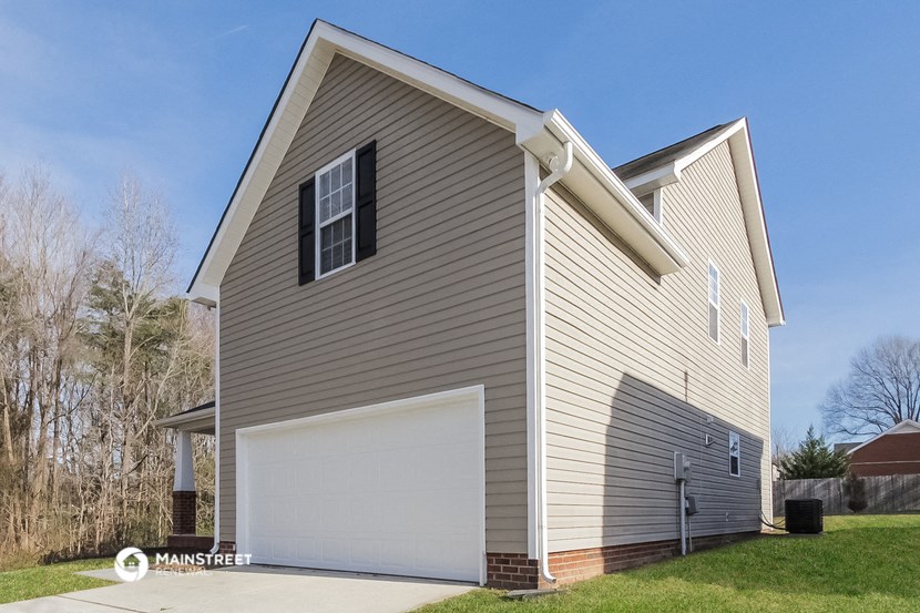a house with a garage and a white garage door