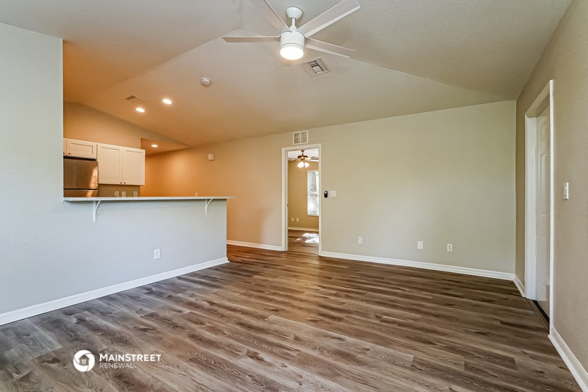 the living room is open to the kitchen and dining area