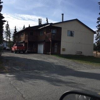 a house with a truck parked in front of it