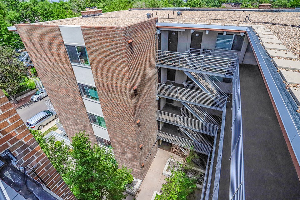 an aerial view of an apartment building with stairs
