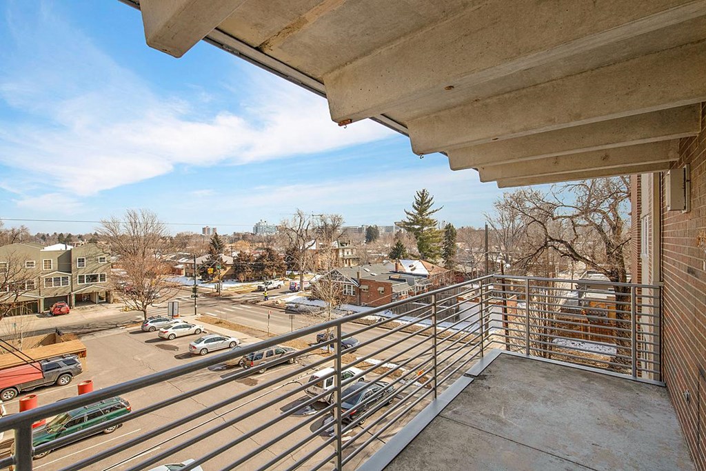 the view of the city from the balcony of a building