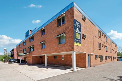 A large brick building with a blue roof and a sign that reads "Levant".