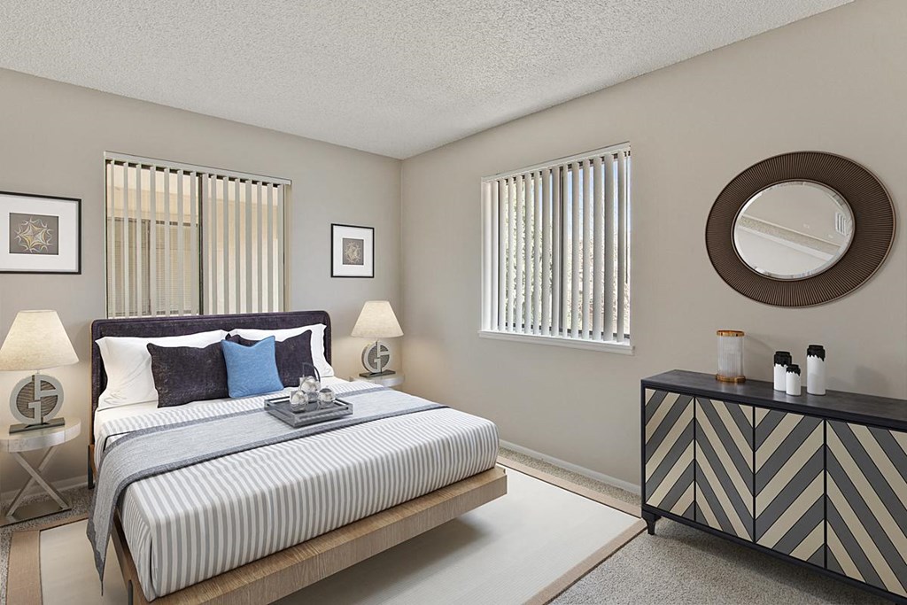 a bedroom with a bed and a dresser