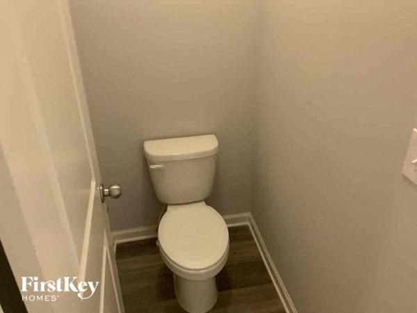 a small bathroom with a white toilet in it