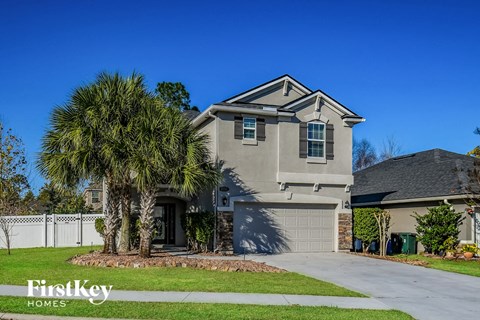 a house with a palm tree in front of it