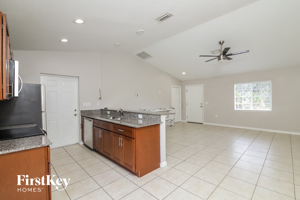 A spacious kitchen with a FirstKey Homes logo.