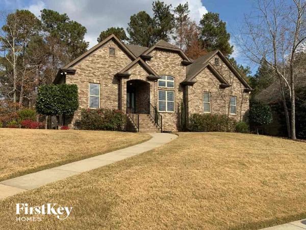 A house with a lawn in front of it.