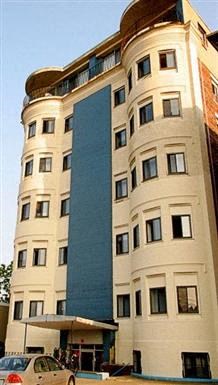 a tall building with a car parked in front of it