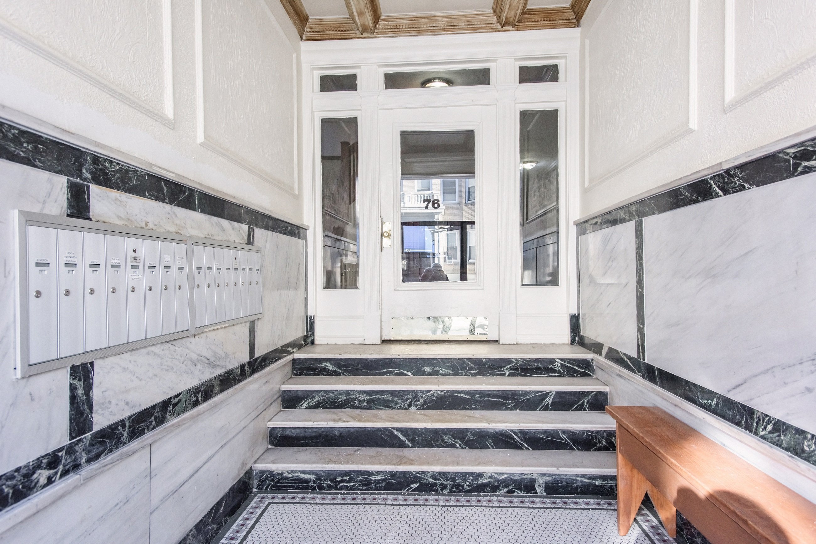 Vestibule with Mailboxes and Stairs to Door