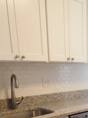 Kitchen with Stainless Appliances, Granite Counters and White Cabinets