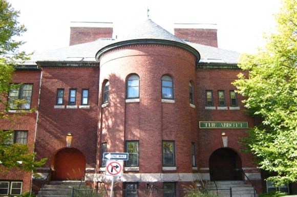 a red brick building with a round tower