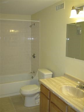 a bathroom with a sink toilet and a shower