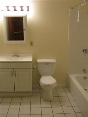 a bathroom with a toilet and a sink and a bath tub