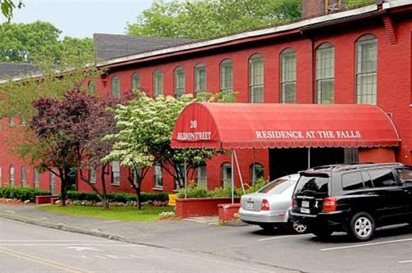 a red building with cars parked in front of it