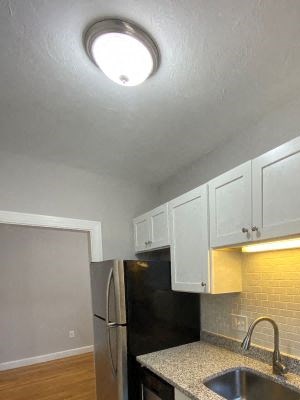 Kitchen Kitchen with granite counters, white cabinets and stainless appliances