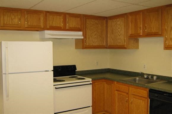 a kitchen with a stove and a refrigerator