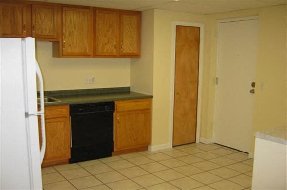a kitchen with a stove and a refrigerator