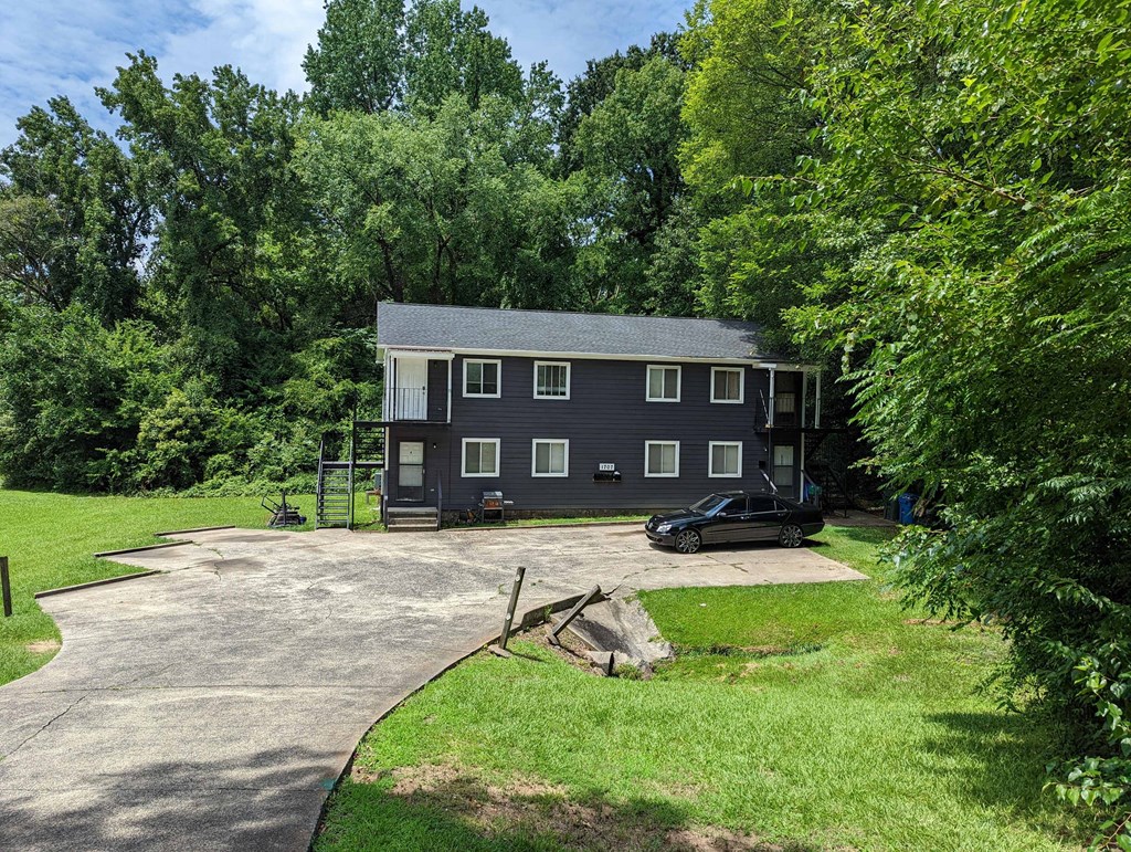a house with a car parked in front of it
