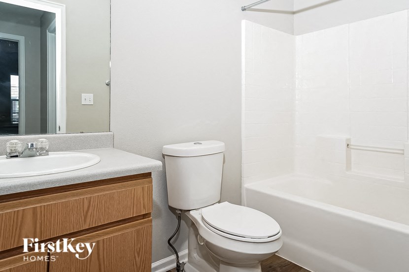 a bathroom with a toilet and a sink