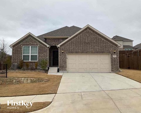 a brick house with a white garage door