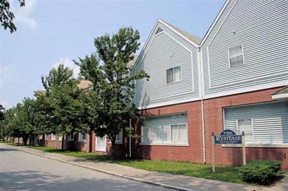 a building with a street sign in front of it