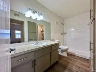 a large bathroom with a sink and a toilet