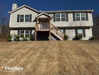a house with a large yard in front of it