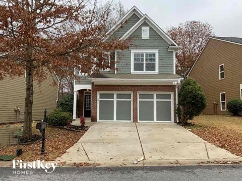 a house with a driveway and a garage door