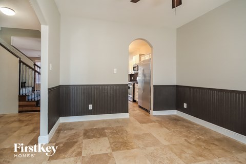 the living room and dining room are open to the kitchen and entryway